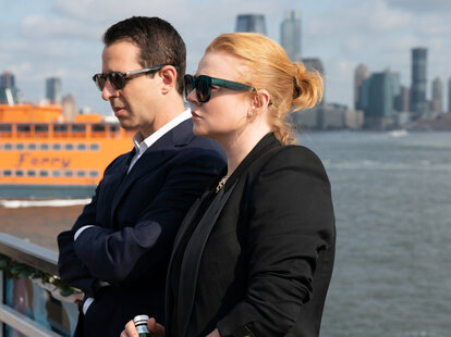 Jeremy Strong and Sarah Snook standing in NYC on the set of HBO' Succesion.