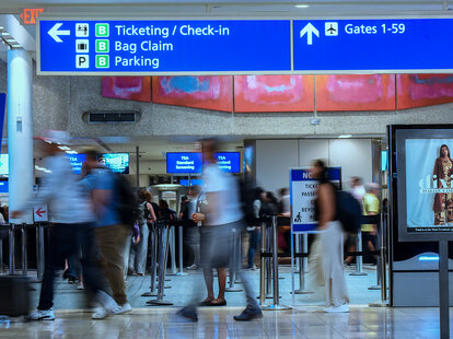 travelers walking through orlando international airport