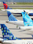 Airplanes from Delta, United and JetBlue populate the taxiway at Laguardia AIrport in the Queens borough of New York City.
