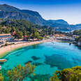Picturesque village of Paleokastritsa and its beach in Corfu, Greece