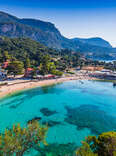 Picturesque village of Paleokastritsa and its beach in Corfu, Greece