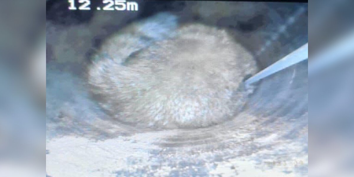 Rescuers Lower Camera Into Pipe And Spot A Furry Baby Stuck Inside