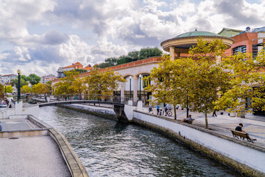 forum aveiro shopping mall on canal with trees in fall