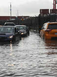 Cars sit stuck in the flooded streets in the Red Hook neighborhood on September 29, 2023 in the Brooklyn borough of New York City. 