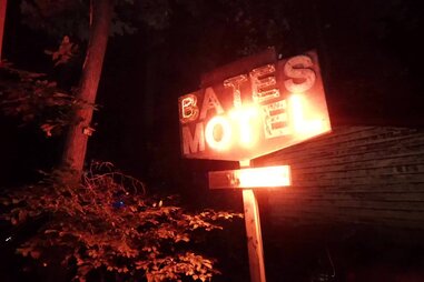 “bates motel” sign lit up with red light
