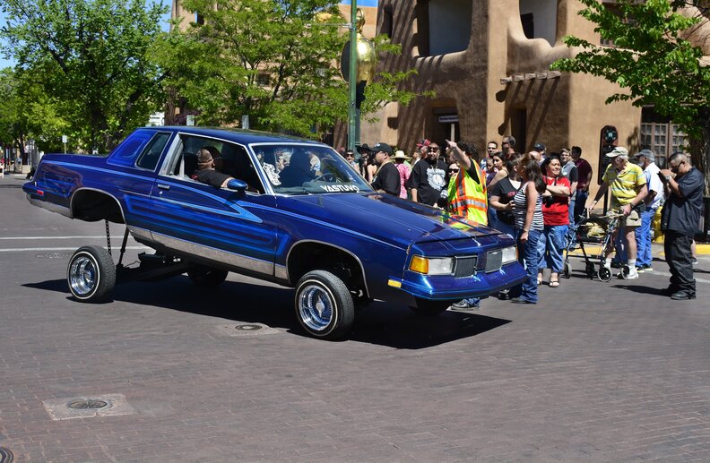 blue lowrider car at santa fe’s lowrider day show