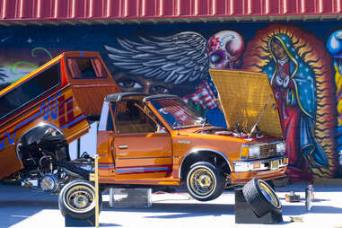 orange lowrider truck at espanola car show