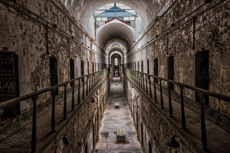 A daytime interior shot of Eastern State Penitentiary, with crumbling walls