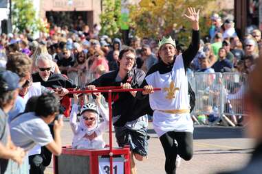 costumed runners coffin racing