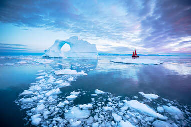 sailboat and icebergs in Greenland