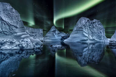 icebergs and northern lights in Greenland