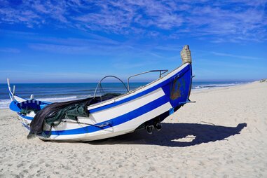 boat on praia de mira beach in portugal