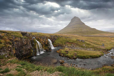 Kirkjufell mountain in iceland with waterfalls in the foreground