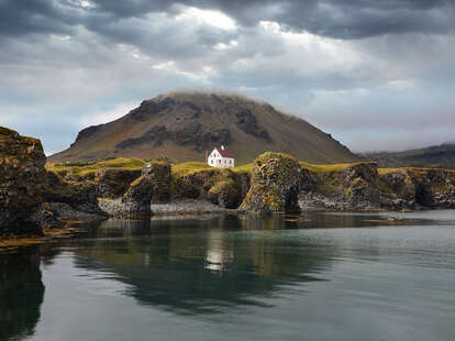 house on lake in Arnarstapi, Iceland