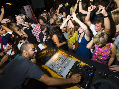dj spinning to a packed crowd in manchester uk
