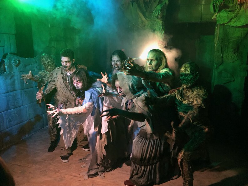 group of actors in a haunted house