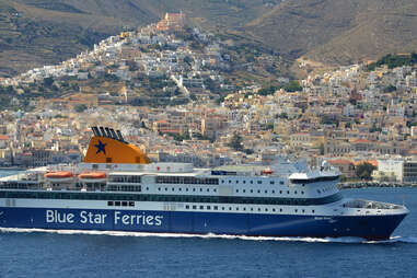 blue star ferry with european town in background