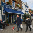 people walking by seafood restaurants in dubln