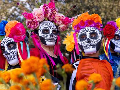 four women wearing skull masks at dia de los muertos celebration san antonio texas