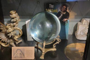 crystal ball next to information about sybil leek