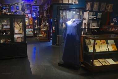 raymond buckland’s illuminated purple robe in gallery space