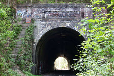 graffiti tunnel over old railroad tracks
