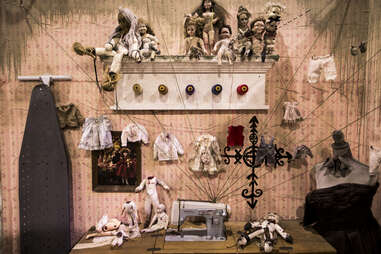 creepy dolls in a sewing room 