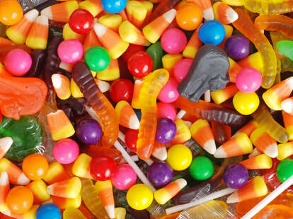 A pile of assorted Halloween candy, including candy corn. 