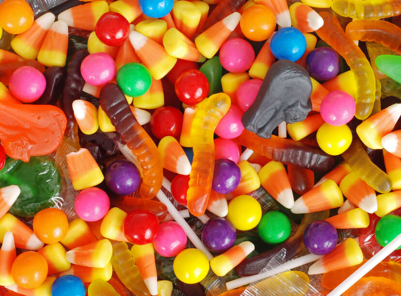 A pile of assorted Halloween candy, including candy corn. 