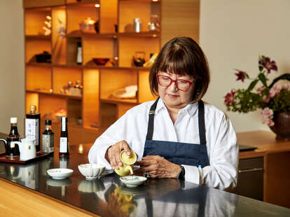 Jane Matsumoto pouring soy sauce at MISE at JACC in Little Tokyo