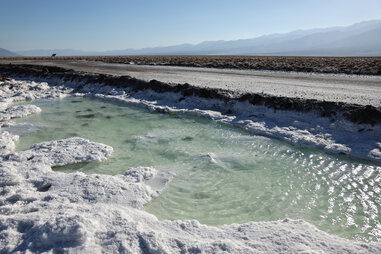 pooled water at death valley national park after hurricane hilary