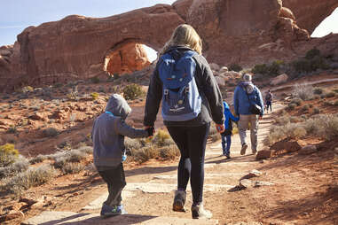 family hiking in the utah desert