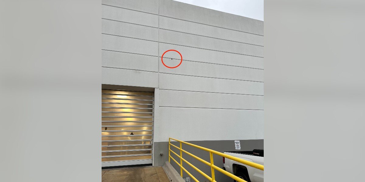 Employee Sees Weird Black Dot On Building — Then Realizes It's ...