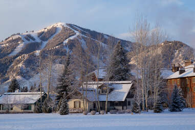 snowy village of kethum, idaho with mountains in the background