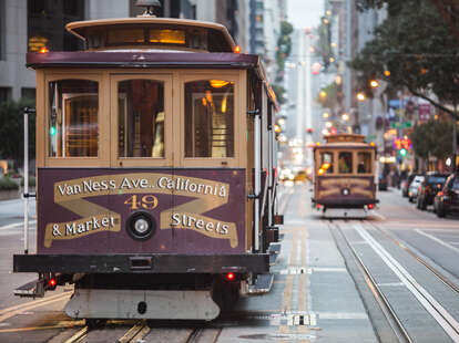 Cable cars on city street, San Francisco, California, USA