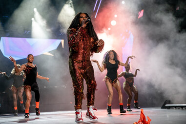 big freedia performing on stage with dancers