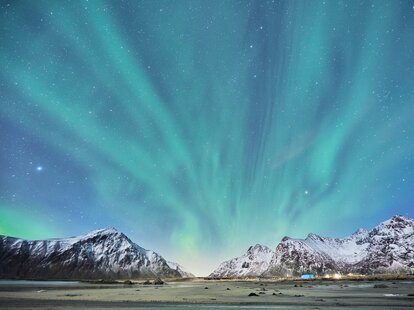A stunning photo of the northern lights over a frozen tundra.