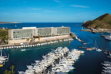 aerial view of breathless cabo san lucas resort surrounded by water