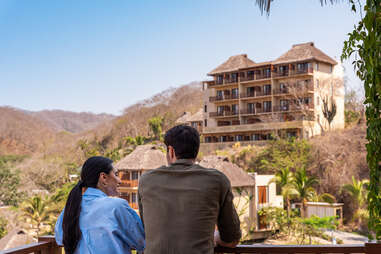 couple looking out at property of riviera nayarit