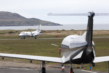 planes on the runway at islay airport, isle of islay