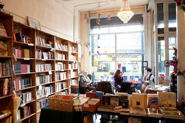 People reading inside the cozy interior of the Winding Stair bookshop.