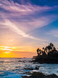 Extremely beautiful  sunset under the coconut palms on Sri Lanka beach.