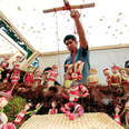 A puppeteer displays his creation for The Night of the Radishes in Oaxaca.