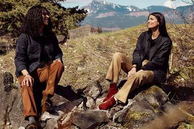 Two people wearing Ginew clothing outdoors.