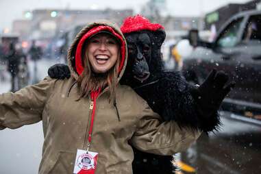 woman posing with person in gorilla costume at dyngus day festival