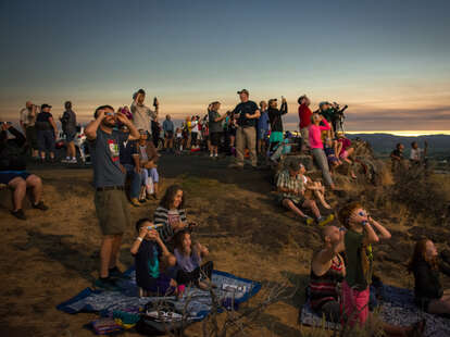 crowd watching eclipse 