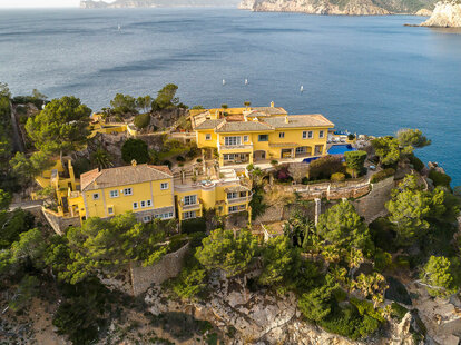 An aerial view of the Yellow Castle, a villa featured in The Crown Season 6, Episode 1.