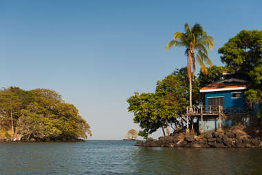 colorful house on top of a formation of rocks on las islas del granada