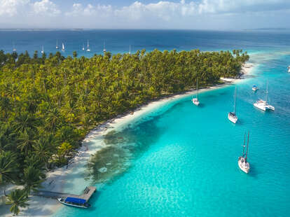 aerial view of yachts sailing on the turquoise waters of san blas islands, panama