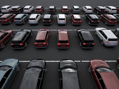 parking lot filled with rental cars